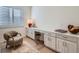 Bright home office with custom built-ins, a comfortable chair, and natural light from a window at 805 Promenade Dr, Superior, CO 80027