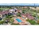 Aerial view of community featuring swimming pool, club house, and manicured landscaping at 4569 Copeland Loop # 203, Highlands Ranch, CO 80126