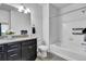 Bright bathroom featuring a bathtub with shower, and vanity with granite countertop at 4569 Copeland Loop # 203, Highlands Ranch, CO 80126
