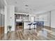 Open kitchen featuring dark cabinetry, granite countertops, stainless appliances, and a breakfast bar with pendant lighting at 4569 Copeland Loop # 203, Highlands Ranch, CO 80126