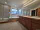 Bathroom featuring a soaking tub, shower, and vanity at 5571 S Sicily St, Aurora, CO 80015