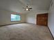 Spacious bedroom featuring a ceiling fan and vaulted ceilings at 5571 S Sicily St, Aurora, CO 80015