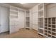 Spacious walk-in closet features custom shelving, drawers, and ample storage space for an organized wardrobe at 5571 S Sicily St, Aurora, CO 80015