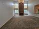 Spacious living room boasts a fireplace, high ceilings, and natural light from large windows at 5571 S Sicily St, Aurora, CO 80015