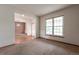 Inviting living room with neutral paint and large window at 5571 S Sicily St, Aurora, CO 80015