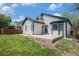Expansive backyard featuring a well-maintained lawn and concrete patio, perfect for outdoor relaxation and entertainment at 4320 Snowbird Ave, Broomfield, CO 80020