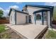 Exterior view showcasing the home's backyard patio and the siding of the house at 4320 Snowbird Ave, Broomfield, CO 80020