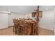 Unique wooden bar featuring custom stools, wood accents, and built-in cabinet at 4320 Snowbird Ave, Broomfield, CO 80020
