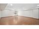 Large, open basement space with wood laminate flooring and a bright, clean aesthetic at 4320 Snowbird Ave, Broomfield, CO 80020