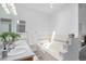 Bright bathroom features a soaking tub, double sinks, and modern fixtures at 4320 Snowbird Ave, Broomfield, CO 80020