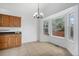 Bright dining area featuring a bay window, tiled floors, and ample natural light at 4320 Snowbird Ave, Broomfield, CO 80020