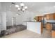 Open-concept kitchen with bar seating and stainless steel appliances perfect for entertaining at 4320 Snowbird Ave, Broomfield, CO 80020