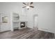Cozy living room with fireplace, built-in shelves, and new floors for modern comfort at 4320 Snowbird Ave, Broomfield, CO 80020