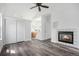 An airy living room with wood floors, a fireplace, and easy access to the bathroom at 4320 Snowbird Ave, Broomfield, CO 80020