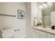 Bathroom featuring a single vanity, tile shower and commode at 12032 Monaco St, Brighton, CO 80602