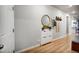 Welcoming entryway featuring wood floors, shoe storage and decor accents at 5771 Slate River Pl, Brighton, CO 80601
