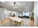 Inviting open-concept with sleek kitchen, dining area, and comfortable living room, great for entertaining at 5771 Slate River Pl, Brighton, CO 80601