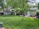 Green backyard offers a large lawn, storage shed, and an outdoor seating area at 18908 E Napa Dr, Aurora, CO 80013