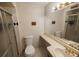 Bright bathroom with a shower and a large countertop area and large mirror providing functional design at 18908 E Napa Dr, Aurora, CO 80013