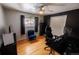 Bedroom with hardwood floors, a window view, a ceiling fan, and a white closet at 18908 E Napa Dr, Aurora, CO 80013