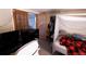 Bedroom with desk, canopy bed, and closet, providing a comfortable and functional space at 18908 E Napa Dr, Aurora, CO 80013