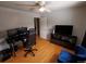 Bedroom with hardwood floors, dark accents, a ceiling fan, and a double-door closet at 18908 E Napa Dr, Aurora, CO 80013