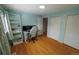 Bright bedroom with modern desk, shelving, and dual closets, perfect for a home office or cozy retreat at 18908 E Napa Dr, Aurora, CO 80013