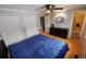 Comfortable bedroom with hardwood floors, a ceiling fan, and dual closets, providing ample storage at 18908 E Napa Dr, Aurora, CO 80013