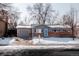 Charming single Gathering home with brick accents, an attached garage, and mature trees in the winter at 18908 E Napa Dr, Aurora, CO 80013