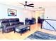 Cozy living room with hardwood floors, a ceiling fan, and comfortable furniture at 18908 E Napa Dr, Aurora, CO 80013