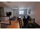 Bright living room with hardwood floors, ceiling fan, and a flatscreen television at 18908 E Napa Dr, Aurora, CO 80013