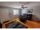 Cozy living room with hardwood floors, ceiling fan and large window providing ample natural light at 18908 E Napa Dr, Aurora, CO 80013