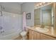 Clean bathroom with tub-shower and vanity at 19225 E Carolina Pl # 102, Aurora, CO 80017