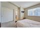 Bright bedroom features double closet and ensuite bathroom at 19225 E Carolina Pl # 102, Aurora, CO 80017