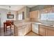 Bright kitchen area with eat-in dining space and hardwood floors at 19225 E Carolina Pl # 102, Aurora, CO 80017