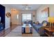 Warm living room with neutral tones, stylish furnishings, and ample natural light through a large window at 19225 E Carolina Pl # 102, Aurora, CO 80017