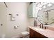 Bathroom featuring tile floors, a shower/tub combo and a vanity with a pink marble countertop at 17601 E Eastman Pl, Aurora, CO 80013