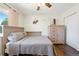 Neutral bedroom with hardwood floors, a ceiling fan, a queen bed, and closet at 17601 E Eastman Pl, Aurora, CO 80013