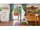 Bright dining area with antique hutch, slider to backyard, and views of a hot tub at 17601 E Eastman Pl, Aurora, CO 80013