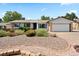 Charming ranch-style home with tidy front yard and attached two-car garage at 17601 E Eastman Pl, Aurora, CO 80013