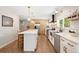 Beautiful eat-in kitchen with stainless steel appliances, white countertops, pendant lights and wooden cabinets at 17601 E Eastman Pl, Aurora, CO 80013