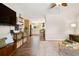 Bright living room leading to a modern kitchen, featuring hardwood floors and stylish decor at 17601 E Eastman Pl, Aurora, CO 80013