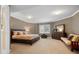 Bedroom with soft carpet, bed, dresser, and a window with plantation shutters at 29432 Camelback Ln, Evergreen, CO 80439