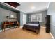 Basement bedroom with wood bed frame, desk, and built-in shelving at 29432 Camelback Ln, Evergreen, CO 80439