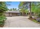 Two-story home with attached garage and landscaping at 29432 Camelback Ln, Evergreen, CO 80439