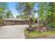 House exterior with driveway and landscaping at 29432 Camelback Ln, Evergreen, CO 80439