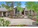 House exterior showcasing a large front yard and a two car garage at 29432 Camelback Ln, Evergreen, CO 80439