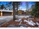 Stunning exterior view of home featuring beautiful landscaping and architectural details at 29432 Camelback Ln, Evergreen, CO 80439