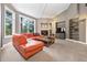 Sun-filled living room with a fireplace and built-in shelving at 29432 Camelback Ln, Evergreen, CO 80439