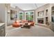 Spacious living room featuring a cozy fireplace and large windows at 29432 Camelback Ln, Evergreen, CO 80439